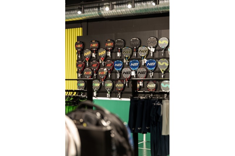 Wall shelf for displaying padel shoes in sports stores