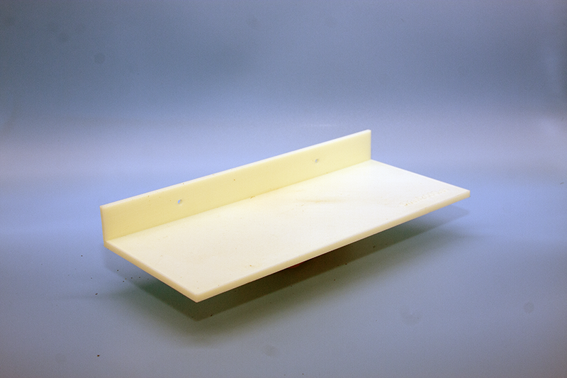 Wall-mounted shoe display shelf made from satin black technical ABS